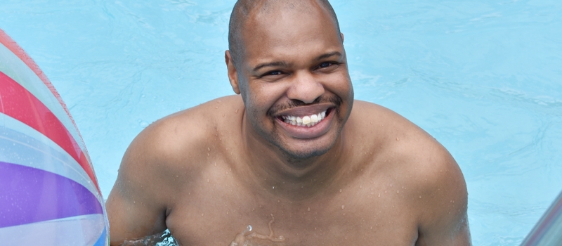 Camper Smiling in Pool
